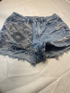 AMIRI Light Blue Distressed Denim Shorts with Black Bandana Patch